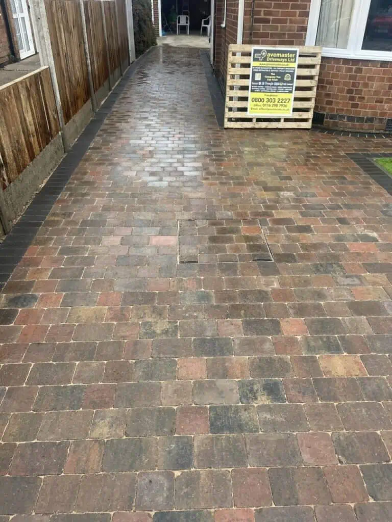 Brindle block paving laid across a residential driveway and path.