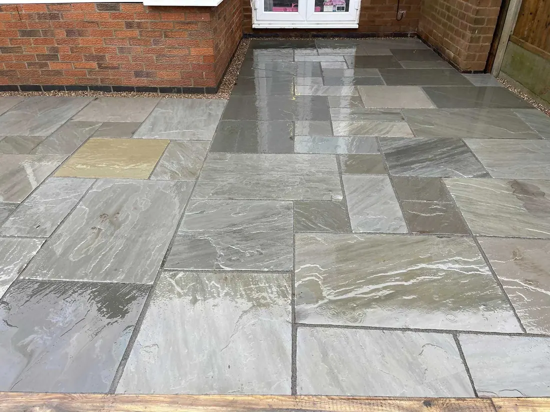 Landscaped garden with defined paving, planting and usable outdoor space.