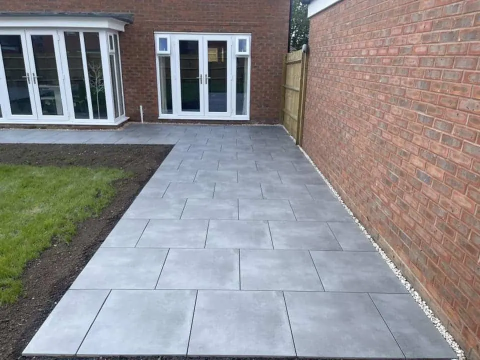 Porcelain patio paving laid in a practical outdoor seating area.