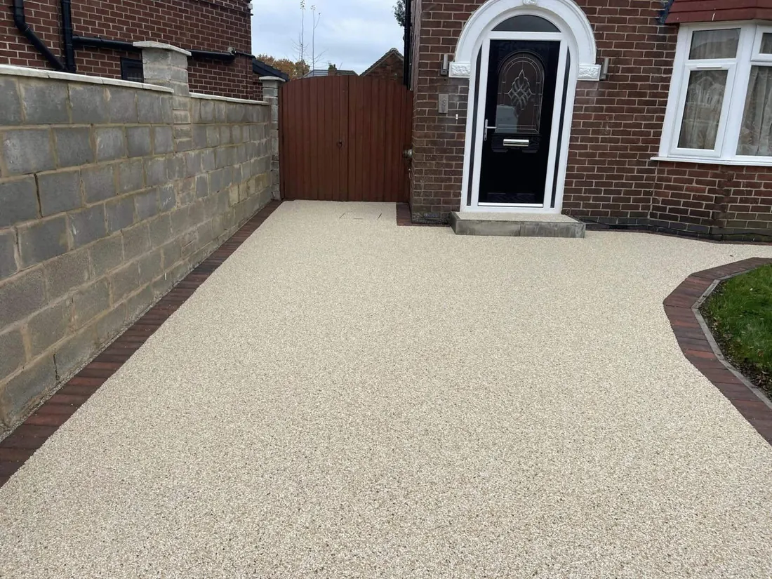 Resin-bound driveway surface with a clean decorative aggregate finish.