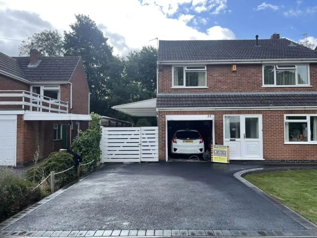SMA tarmac driveway SMA tarmac driveway with a curved entrance and contrasting block-paved edging.